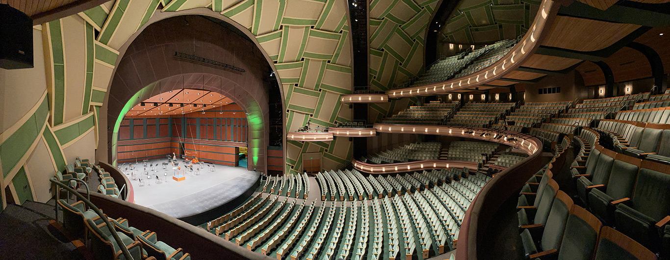 Image of the Silva Hall stage and audience from the left wing