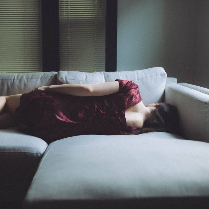 woman laying on couch